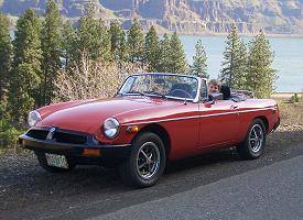 Click to see full size pic of Pat sitting is his MGB, waiting for his 16th birthday