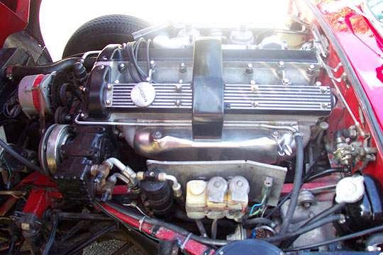The beautiful XKE engine , based on an aeronautical design, is a work of art and the focal point E-type